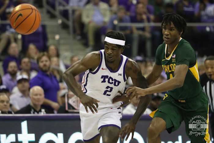TCU's Emanuel Miller fights for a ball against Baylor's Ja'Kobe Walter on February 26, 2024.